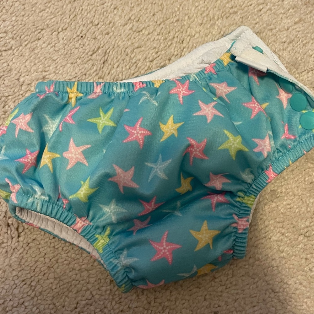 18mos girl’s reusable swim diaper with ruffles.